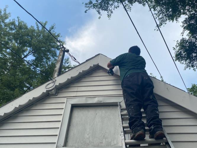 Gardener mowing the lawn. Landscape design. Gardening